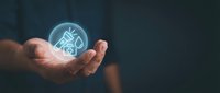 Businessman hand holding glowing holographic house icon with digital technology interface for real estate, property investment, smart home solutions, and future housing concepts.