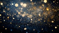 Magical golden bokeh lights and glowing particles floating on dark blue background create dreamy festive atmosphere for holiday designs and celebrations.