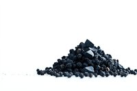 Black peppercorns and ground pepper pile on white background, macro food photography showing texture and detail of spice ingredients for cooking and seasoning.