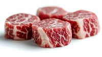 Raw marbled beef steaks with rich fat marbling on white background, premium cuts ready for grilling, cooking and culinary preparation.