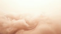 Soft peachy clouds swirling in dreamy sky, creating serene atmospheric backdrop for wellness, meditation, and relaxation design projects.
