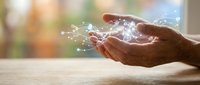Digital data flowing from open hands symbolizing technology transfer, innovation sharing, and wireless connectivity for business solutions.