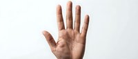 Male hand showing open palm gesture against white background isolated for design and communication concepts.