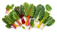 Fresh rainbow chard leaves with colorful stems isolated on white background. Organic leafy greens for healthy cooking and nutrition concepts.