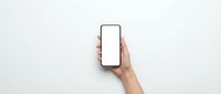 Hand holding modern smartphone with blank white screen mockup against light gray background for app presentation and digital marketing materials.