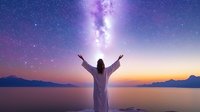 Silhouette of person in white robe with raised arms against cosmic night sky, purple milky way, and mountain lake landscape at sunset, spiritual meditation concept.
