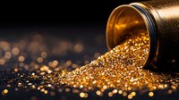 Spilled golden glitter particles from black container creating magical sparkle effect on dark background with bokeh lights and reflective shimmer surface.