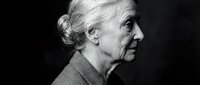 Senior woman with white hair in profile against dark background, suitable for healthcare, aging, and portrait projects.
