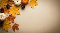 Autumn flat lay with golden maple leaves, white pumpkins and pine cones on beige background. Seasonal fall decoration for thanksgiving greeting cards.
