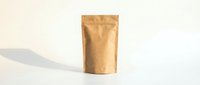 Kraft paper stand-up pouch on white background, eco-friendly resealable packaging mockup for coffee, tea, snacks, or organic products.