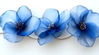 Delicate blue translucent flowers arranged in row on white background, with subtle shadows and fine details showing petal transparency and dark stamens.