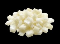 Pile of diced white onion pieces isolated on transparent background, ready for food design, clipart, print on demand, stickers, and culinary themed projects.