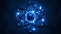 Glowing blue atomic structure with orbiting electrons on dark background for science education and technology concepts.