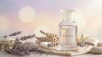 Lavender essential oil bottle with fresh purple flowers on wooden tray, aromatherapy and natural wellness spa treatment concept for relaxation.