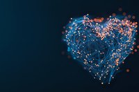 Digital heart shape formed by connected dots and lines glowing with blue and orange light effects on dark background, symbolizing technology and love connection.