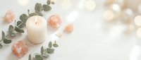 Spa wellness setup with burning candle, pink salt crystals and eucalyptus leaves on white background for relaxation and self-care rituals.