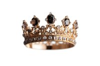Ornate vintage style golden crown with black gemstones and crystals on white background, royal jewelry isolated for design projects and creative use.