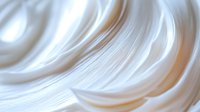 Smooth white silky fabric waves creating elegant flowing curves and soft folds against light background, luxury textile abstract macro photography.