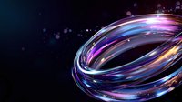 Luminous swirling rings with glowing blue, purple and pink light trails against dark background create dynamic motion effect with floating particles and bokeh elements.