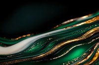 Luxurious emerald green and gold abstract waves with glitter effect create flowing lines against dark background, modern art composition for luxury design.