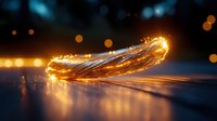 Glowing golden light trails curve gracefully across dark surface creating magical ethereal effect with bokeh lights in background for fantasy designs.