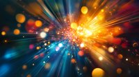 Vibrant explosion of light rays and glowing particles against dark background creates dynamic motion effect with blue and orange color spectrum.