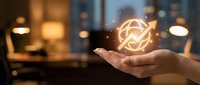 Businessperson holding glowing refresh icon with arrow symbol, representing technology, innovation, and digital transformation in modern office environment.