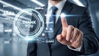 Professional businessman in dark suit touching holographic thank you interface with digital analytics and data visualization elements in modern office.