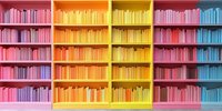Colorful rainbow bookshelf with books arranged by color from pink through yellow, orange, red and blue creating vibrant gradient effect in modern library interior.
