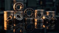Automotive engine parts including pistons and bearings arranged on reflective surface with dramatic lighting for mechanical engineering concepts.