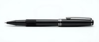 Black ballpoint pen with silver accents isolated on white background for business and office design projects.