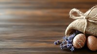 Rustic burlap sack with dried lavender sprigs and decorative eggs on wooden background, creating warm natural composition for seasonal decor.