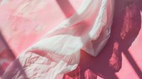 Soft white fabric with flowing folds casting dramatic shadows on pink background, creating abstract shapes and textures in natural light. Minimalist artistic composition.