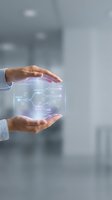 Businessperson holding glowing digital network interface with circuit connections and data flow visualization, representing technology innovation and digital transformation for corporate solutions.