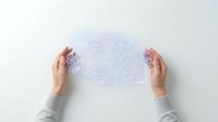 Hands holding transparent digital interface with glowing circuit board and network connections for technology, innovation, and digital transformation concepts.
