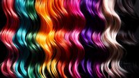 Vibrant wavy strands of multicolored hair in rainbow spectrum from red to purple on black background, showcasing modern hair coloring trends and creative styling.