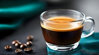 Fresh espresso shot with golden crema in transparent glass cup on dark background with roasted coffee beans and teal textile. Macro food photography.