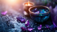 Mystical spa composition with glowing candles in decorative bowls and scattered purple petals on dark textured surface, creating serene atmosphere.