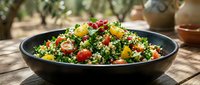 Colorful tabbouleh salad with fresh vegetables, herbs and grains in black bowl, Mediterranean cuisine for healthy eating and recipe content.