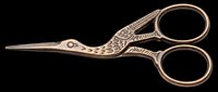 Ornate bird-shaped embroidery scissors with decorative bronze finish, isolated on transparent background. Ready for clipart, print-on-demand, t-shirt design, stickers, and sublimation projects.