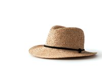 Classic woven straw fedora hat with black band on white background, isolated summer accessory for fashion and beach lifestyle designs.