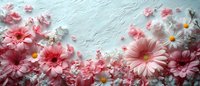 Pink gerbera daisies and delicate spring blossoms scattered on light textured background create romantic floral border composition for wedding stationery design.
