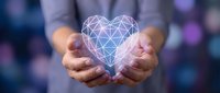 Hands holding glowing geometric heart with polygonal wireframe design against blurred bokeh background for healthcare technology and digital wellness concepts.