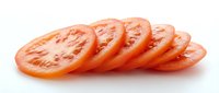 Fresh ripe tomato slices arranged in a row on white background, ideal for food and culinary design projects.
