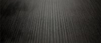 Dark gray textured surface with vertical linear pattern creating depth and dimension for modern interior design backgrounds.