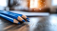 Sharp blue wooden pencils on dark wooden surface with magical glowing bokeh effect and floating butterflies, creative educational concept for school and art.
