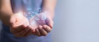 Hands holding glowing digital network connections and data particles, representing technology innovation, cloud computing, and wireless communication for business solutions.