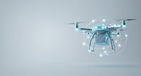 Futuristic drone with holographic digital interface and glowing network visualization, representing advanced technology, autonomous flight, and innovation for tech industry applications.