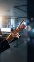 Business professional hands touching digital interface with glowing light effects in modern office environment for technology and innovation concepts.