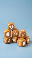 Wooden dice with healthcare medical icons symbols stacked on blue background for wellness education and health concept design.